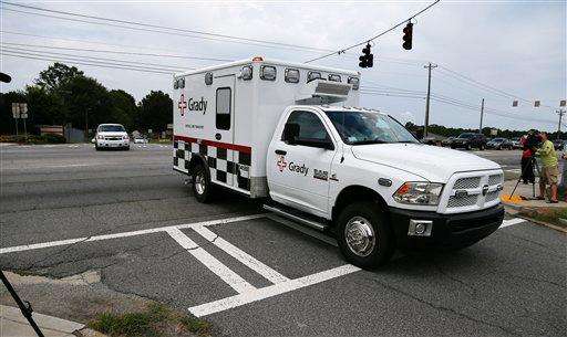 APTOPIX Ebola
An ambulance departs Dobbins Air Reserve Base near Interstate 75, Saturday, Aug. 2, 2014, in Marietta, Ga. Officials at Emory University Hospital in Atlanta expect an American that was infected with the Ebola virus to be transported today.(AP Photo/John Bazemore)