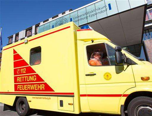 Germany Ebola
A man in special protection suit sits in an ambulance in front of the entrance of Eppendorf hospital in Hamburg, Germany, Wednesday Aug. 27, 2014. Officials say an epidemiologist who was infected with Ebola while working for the World Health Organization in Sierra Leone has arrived in Germany for treatment. Hamburg health department spokesman Roland Ahrendt said Wednesday the doctor would be treated in the city’s UKE hospital at WHO’s request. WHO spokeswoman Fadela Chaib said the patient is a man from Senegal who was working for the WHO as a consultant when infected by the virus in Sierra Leone. To date, the WHO says more than 240 health care workers have developed the disease in Guinea, Liberia, Nigeria and Sierra Leone, and more than 120 have died. (AP Photo/dpa,Georg Wendt)